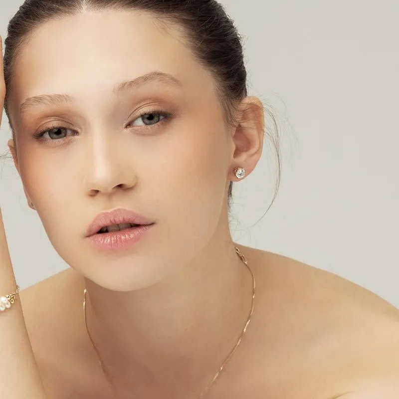 14 Carat Gold Earrings In a 7mm White Zircon Inlay